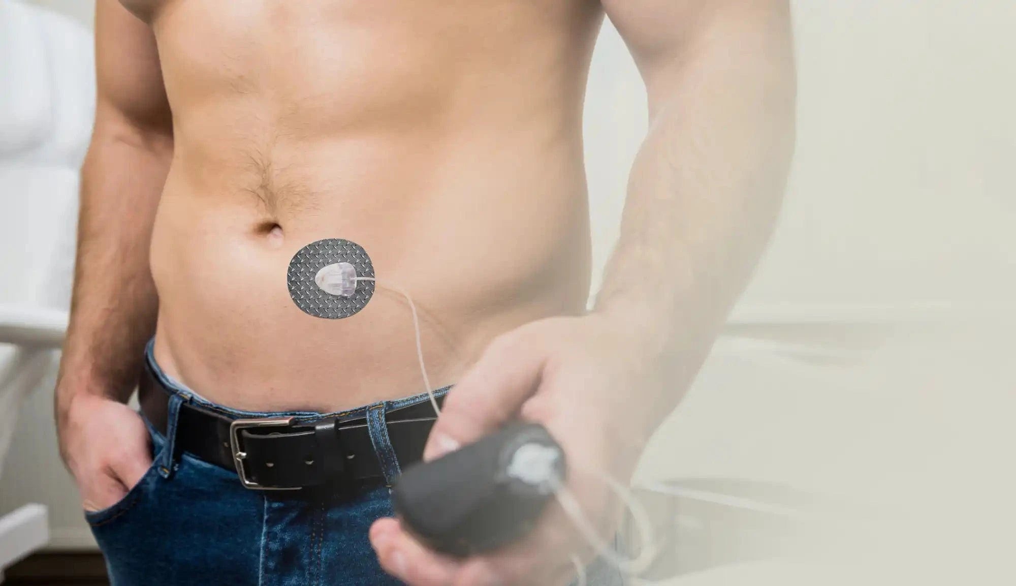 Circular sensor patch adhered to a person’s abdomen.